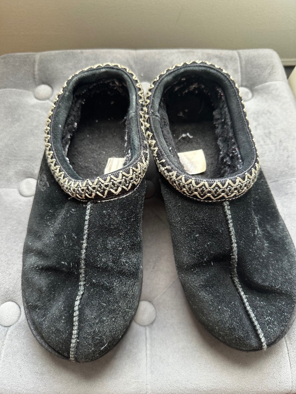 UGG Black fuzzy slippers with decorative trim
